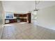 Open-concept kitchen, dark cabinets, and tile flooring, connecting seamlessly to the dining and living areas at 1446 S Revere --, Mesa, AZ 85210
