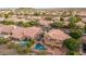 Aerial view of house with pool and surrounding homes at 1622 E Nighthawk Way, Phoenix, AZ 85048