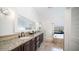 Bathroom with granite countertops, double sinks, and a shower/tub combo at 1622 E Nighthawk Way, Phoenix, AZ 85048