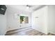 Bright bedroom with wood-look floors and a built-in Murphy bed at 1622 E Nighthawk Way, Phoenix, AZ 85048