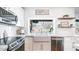 Modern kitchen featuring a farmhouse sink and white cabinetry at 1622 E Nighthawk Way, Phoenix, AZ 85048