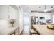 Bright kitchen with an island and white shaker cabinets at 1622 E Nighthawk Way, Phoenix, AZ 85048