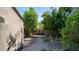Landscaped walkway leading through lush greenery to a gate at 1622 E Nighthawk Way, Phoenix, AZ 85048