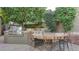 Outdoor kitchen with built-in grill and stone countertops at 1622 E Nighthawk Way, Phoenix, AZ 85048