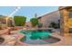 Stunning kidney-shaped pool at night with string lights and landscaping at 1622 E Nighthawk Way, Phoenix, AZ 85048