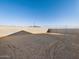 Large, empty backyard with block wall and sandy ground at 22550 W Tonopah Dr, Surprise, AZ 85387