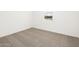 Simple bedroom with neutral carpet and window at 22550 W Tonopah Dr, Surprise, AZ 85387
