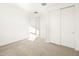Bright bedroom featuring double door closet at 22550 W Tonopah Dr, Surprise, AZ 85387