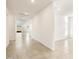 Bright hallway with tile flooring, leading to other rooms at 22550 W Tonopah Dr, Surprise, AZ 85387