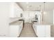 Modern kitchen with white cabinets and granite countertops at 22550 W Tonopah Dr, Surprise, AZ 85387