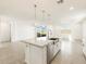 Modern kitchen island with granite countertop and stainless steel dishwasher at 22550 W Tonopah Dr, Surprise, AZ 85387