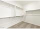 Large walk-in closet with shelving and hanging rods at 22550 W Tonopah Dr, Surprise, AZ 85387