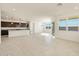 Open floor plan boasting kitchen island and sunny Gathering room at 36913 W La Paz St, Maricopa, AZ 85138