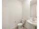 Simple bathroom with white sink and toilet at 36914 W La Paz St, Maricopa, AZ 85138