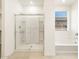 Modern bathroom with a large shower and tub at 36914 W La Paz St, Maricopa, AZ 85138