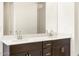 Bathroom with double vanity and a large mirror at 36914 W La Paz St, Maricopa, AZ 85138