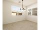 Bright dining room with tile flooring and chandelier at 36914 W La Paz St, Maricopa, AZ 85138