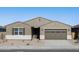 One-story house with brown garage door at 36914 W La Paz St, Maricopa, AZ 85138