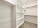 Spacious walk-in closet with ample shelving and hanging space at 36914 W La Paz St, Maricopa, AZ 85138