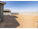 Large backyard with potential for customization, featuring a block fence and landscaping opportunities at 8612 W Warner St, Tolleson, AZ 85353