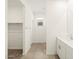 Bathroom featuring tile flooring, closet and single sink vanity with chrome faucet at 8612 W Warner St, Tolleson, AZ 85353