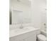 Clean bathroom featuring a modern vanity, a large mirror, and a shower-tub combo for relaxation at 8612 W Warner St, Tolleson, AZ 85353