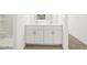 Bathroom featuring tile flooring, double sinks and a shower at 8612 W Warner St, Tolleson, AZ 85353
