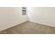 Comfortable bedroom with a window, carpet, and neutral walls, offering a peaceful and serene space at 8612 W Warner St, Tolleson, AZ 85353