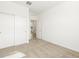 Inviting bedroom with carpet, closet, and an open door creating a sense of spaciousness and comfort at 8612 W Warner St, Tolleson, AZ 85353