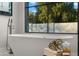 Luxurious bathroom with freestanding tub and large window at 9810 N 57Th St, Paradise Valley, AZ 85253