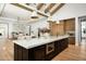 Bright, open kitchen featuring a large island, and wood cabinets at 9810 N 57Th St, Paradise Valley, AZ 85253