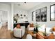 Stylish living room with comfortable seating, elegant artwork, and a bar area, perfect for entertaining guests at 9810 N 57Th St, Paradise Valley, AZ 85253