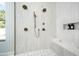 Large walk-in shower with multiple shower heads and built-in niche at 9810 N 57Th St, Paradise Valley, AZ 85253