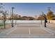 Inviting sports court featuring a basketball hoop and net, perfect for outdoor activities and recreation at 9810 N 57Th St, Paradise Valley, AZ 85253