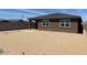Backyard with a block wall and a covered patio area at 20293 N 225Th Dr, Surprise, AZ 85387