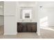 Bathroom featuring double sinks with dark wood cabinets, mirror, and tile floors at 20293 N 225Th Dr, Surprise, AZ 85387