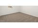 Neutral carpeted bedroom featuring a bright, blank canvas ready for personalization and decor at 20293 N 225Th Dr, Surprise, AZ 85387