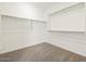 Walk-in closet with ample shelving and carpeted flooring at 20293 N 225Th Dr, Surprise, AZ 85387