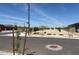 Wide street in a residential area with landscaped medians and newly built single Gathering homes at 20293 N 225Th Dr, Surprise, AZ 85387