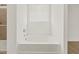 Bright bathroom with a relaxing tub under a window with blinds at 20357 N 225Th Dr, Surprise, AZ 85387