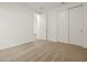 Bedroom with neutral carpet and a double-door closet at 20357 N 225Th Dr, Surprise, AZ 85387