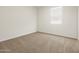 Cozy bedroom with neutral carpet and natural light from a window at 20357 N 225Th Dr, Surprise, AZ 85387
