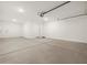 Two-car garage with ample parking space and modern lighting at 20357 N 225Th Dr, Surprise, AZ 85387