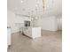 Spacious open floor plan showcasing a modern kitchen with a large island flowing into the living area at 20357 N 225Th Dr, Surprise, AZ 85387