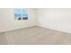 Simple bedroom with neutral carpeting and window at 22526 W Tonopah Dr, Surprise, AZ 85387