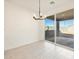 Bright dining area with sliding door to patio at 22526 W Tonopah Dr, Surprise, AZ 85387