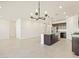 Open concept living room with kitchen view at 22526 W Tonopah Dr, Surprise, AZ 85387