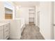 Modern bathroom with white vanity, bathtub, and walk-in shower at 36954 W La Paz St, Maricopa, AZ 85138
