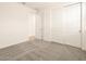 Spacious bedroom with carpet flooring and double door closet at 36954 W La Paz St, Maricopa, AZ 85138