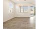 Bright dining area with tile floors and sliding glass door at 36954 W La Paz St, Maricopa, AZ 85138